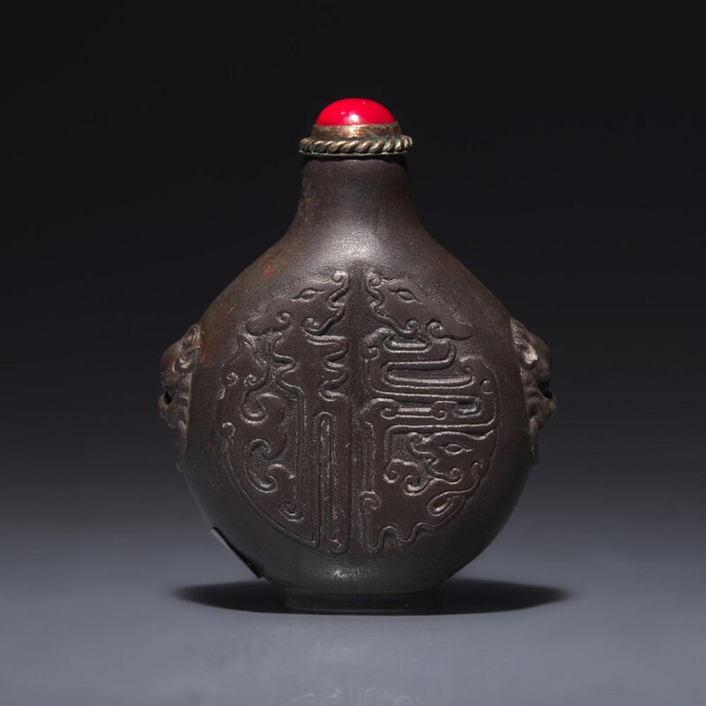 A Chinese Carved Duan Stone Snuff Bottle, Circa 1750-1820 1750-1820年 端石刻龍紋鼻烟壺