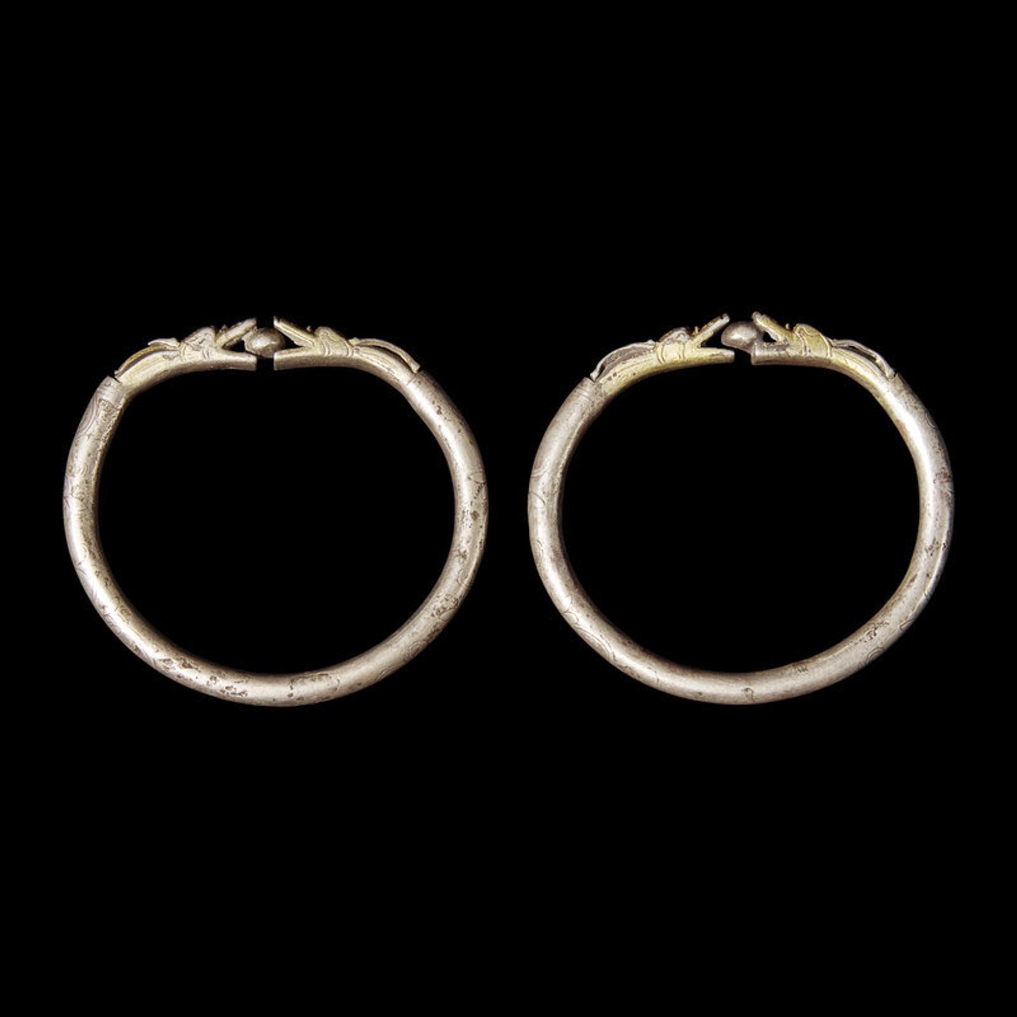 Six Chinese Silver 'Dragon' Bracelets, Qing Dynasty 清 銀龍頭紋鐲六隻