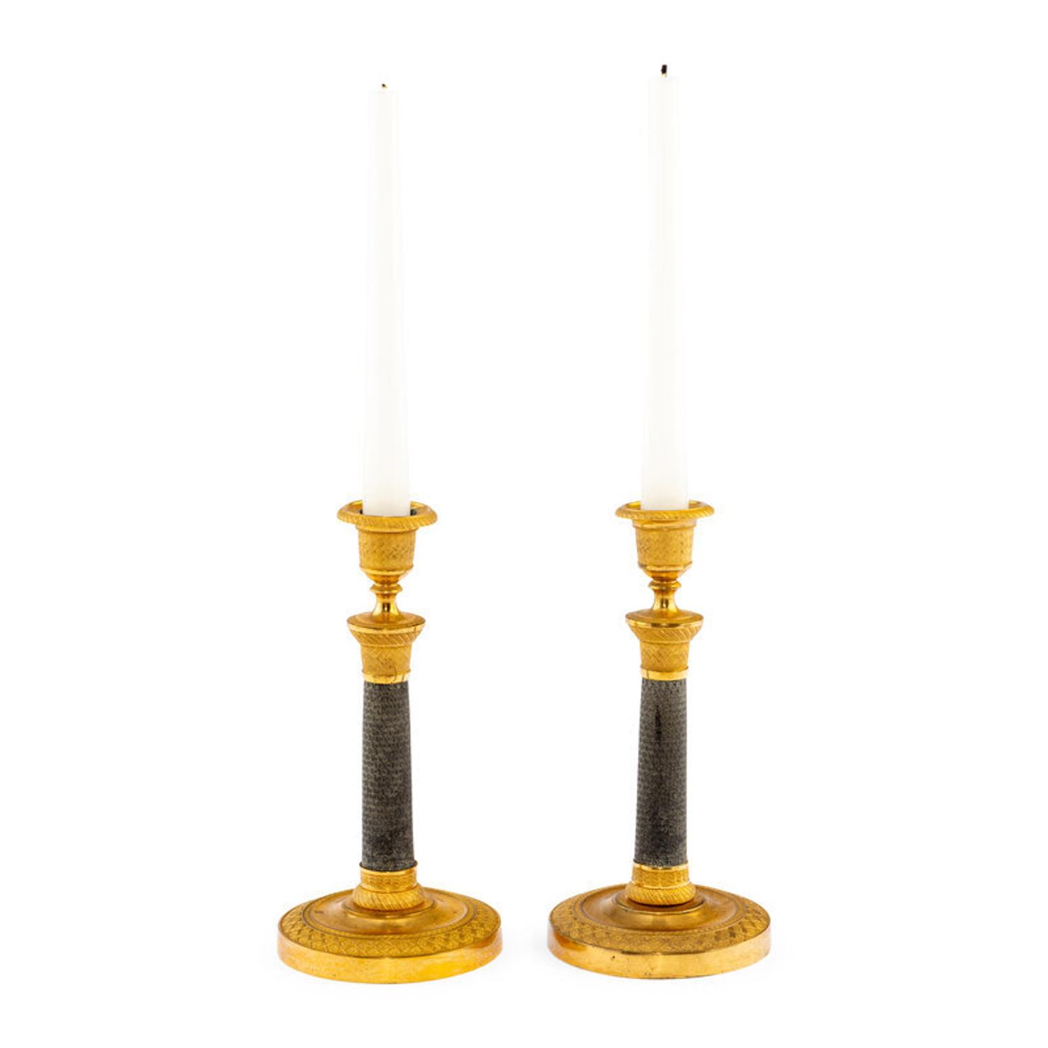 A Pair of Continental Gilt and Patinated Bronze Candlesticks