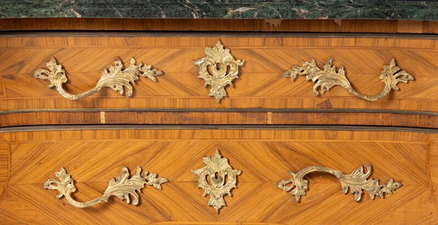 A Pair of Régence Style Gilt Bronze Mounted Tulipwood Marble-Top Commodes