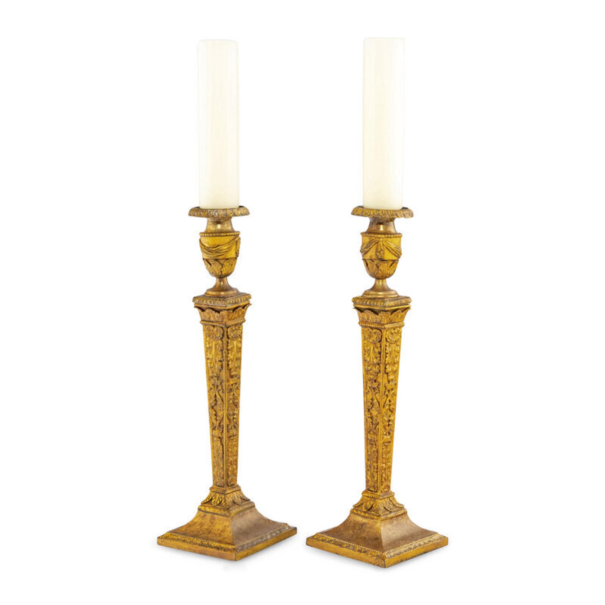 A Pair of Continental Gilt Iron Candlesticks