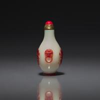 A Chinese Miniature Red-Overlaid Opaline Glass Snuff Bottle, Circa 1750-1820 1750-1820年 涅白地套寶石紅料螭龍紋小鼻烟壺