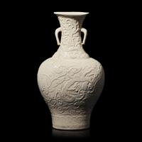A Chinese White Glazed Soft Paste Molded 'Dragons and Lingzhi' Vase, 18th Century 清中期 白釉模印漿胎靈芝螭龍紋瓶
