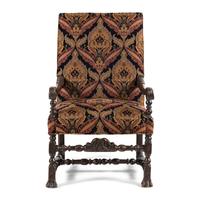 A Louis XIII Carved Walnut Fauteuil
