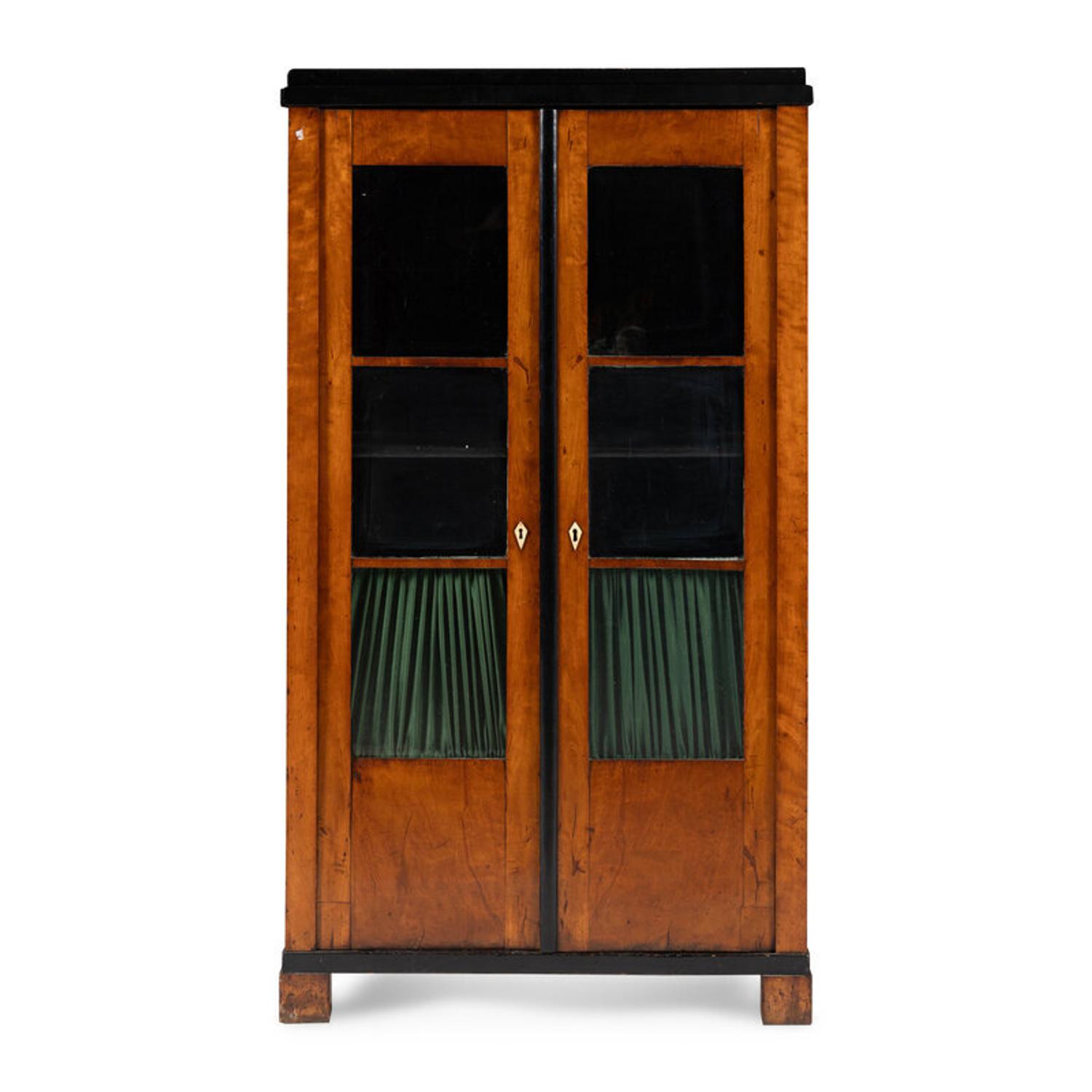 A Biedermeier Figured Maple and Part-Ebonized Bookcase