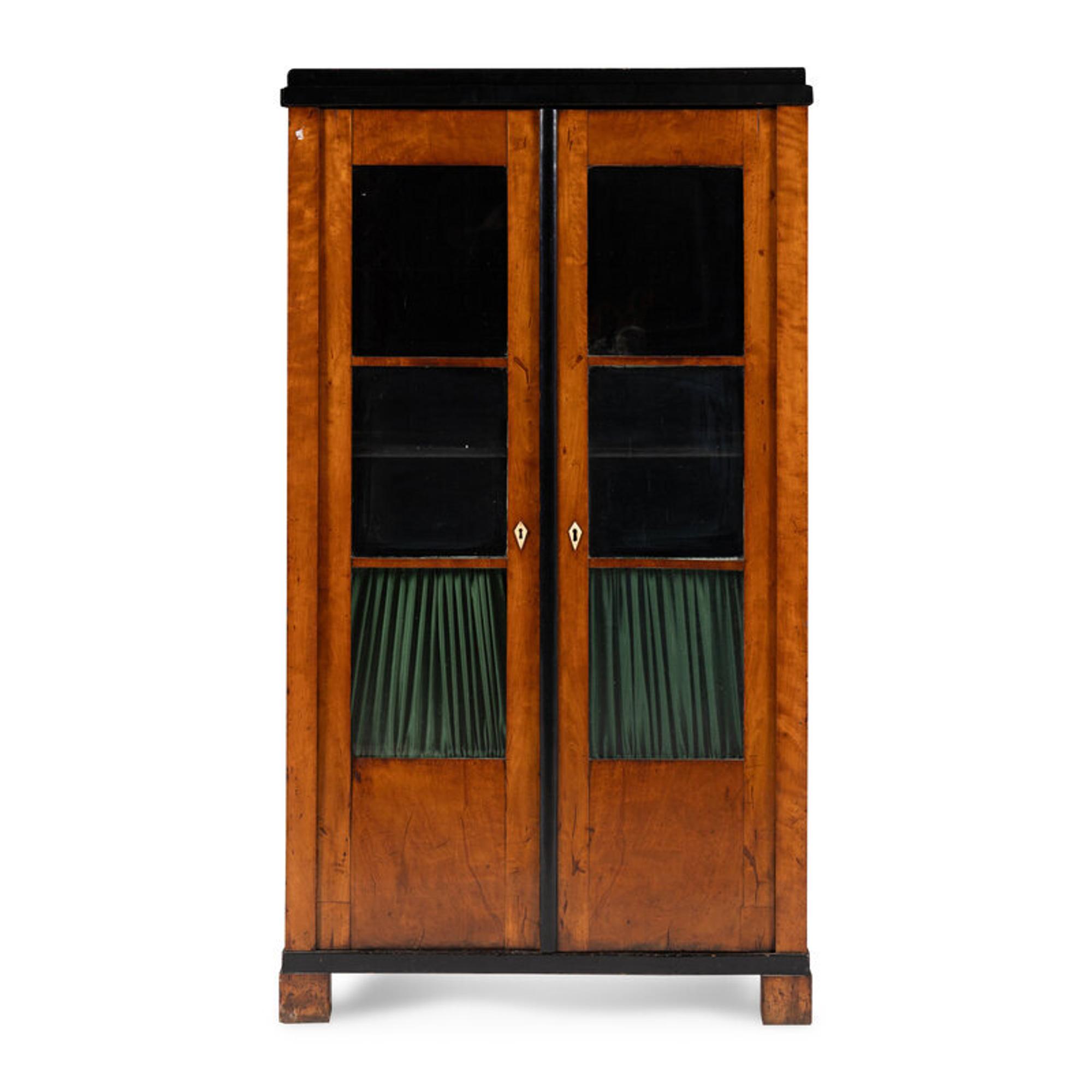 A Biedermeier Figured Maple and Part-Ebonized Bookcase