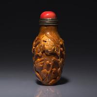 A Chinese Bird and Flower-Carved Root Amber Snuff Bottle 琥珀雕花鳥鼻烟壺
