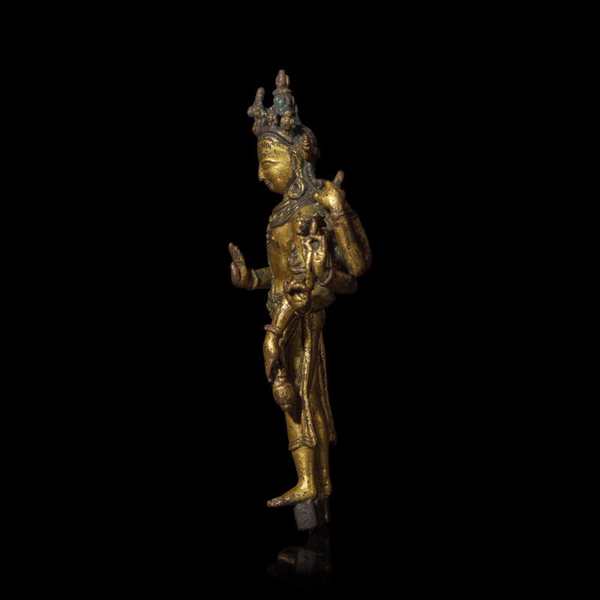 A Nepalese Gilt Bronnze Standing Figure of Avalokiteshvara, 14th/15th Century 十四/十五世紀 尼泊爾銅鎏金菩薩立像