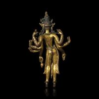 A Nepalese Gilt Bronnze Standing Figure of Avalokiteshvara, 14th/15th Century 十四/十五世紀 尼泊爾銅鎏金菩薩立像