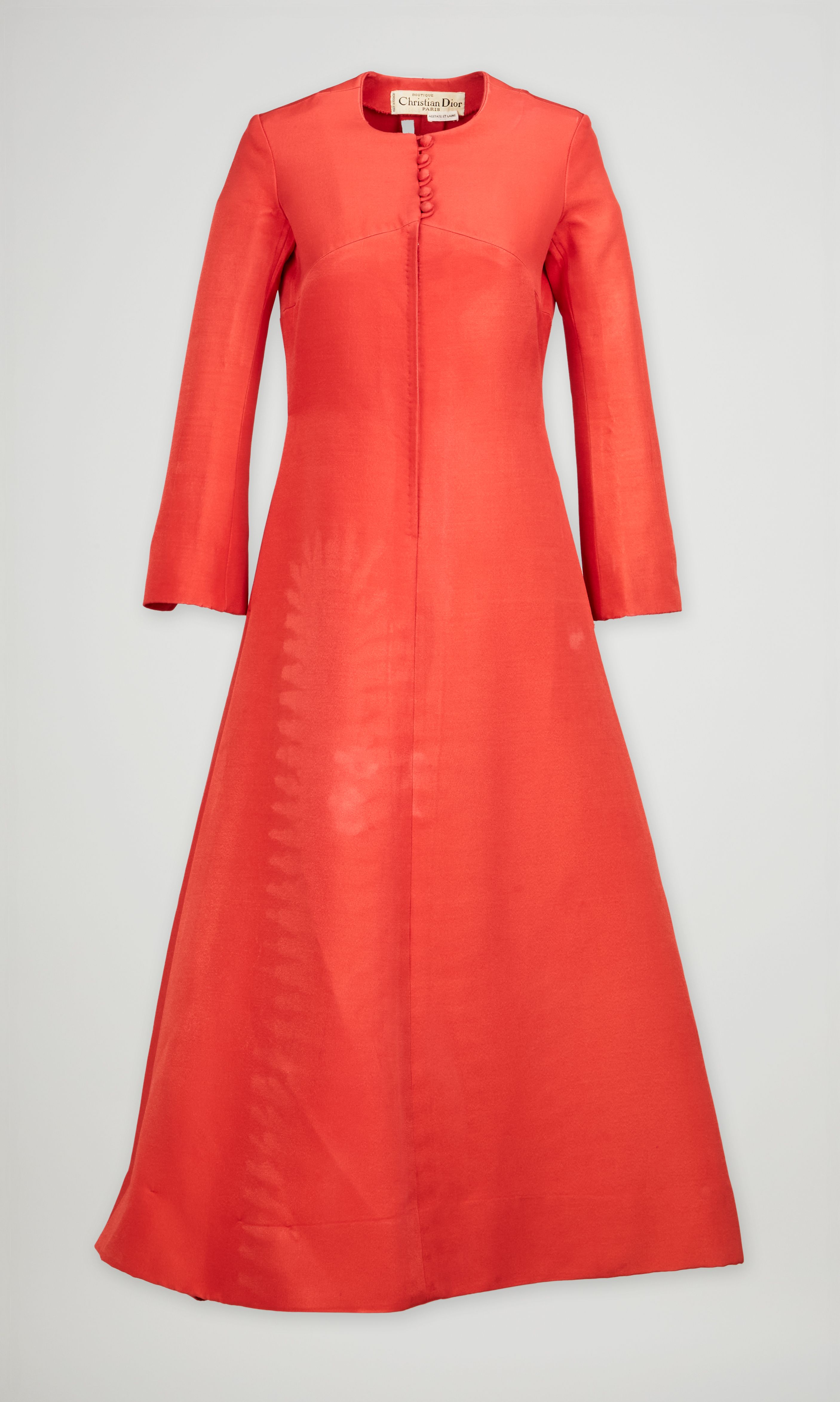 christian dior orange dress Christian Dior Paris Ready to Wear Autumn Winter Model wearing bright orange  pleated strapless dress Stock Photo
