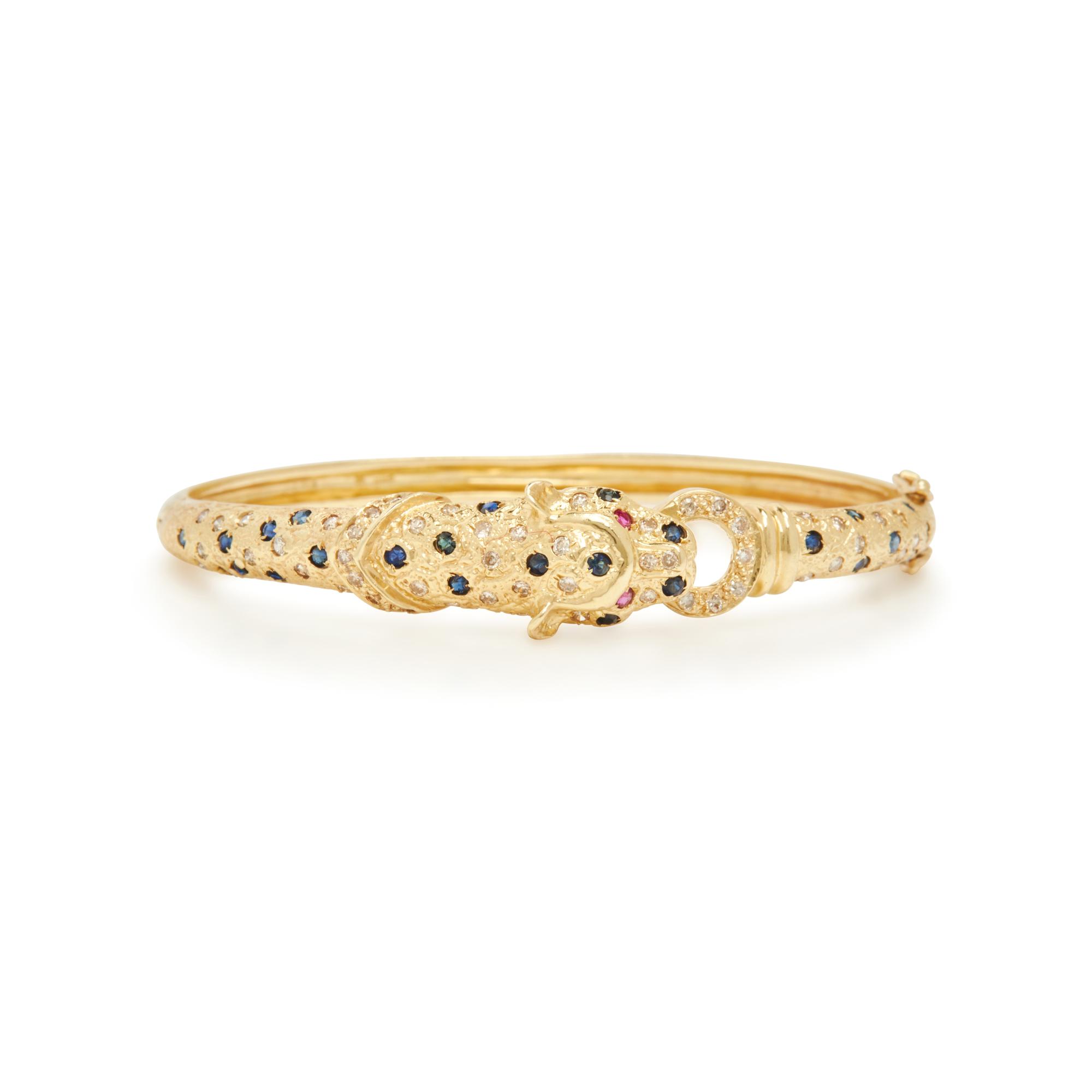YELLOW GOLD AND GEMSTONE PANTHER BANGLE BRACELET