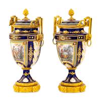 A Pair of Sèvres Style Porcelain, Enameled and Gilt Bronze Mounted Urns