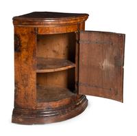 A Pair of North Italian Walnut Corner Cupboards