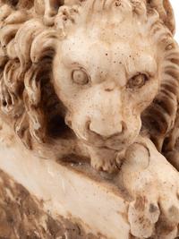 A Pair of Composition Marble Recumbent Lions