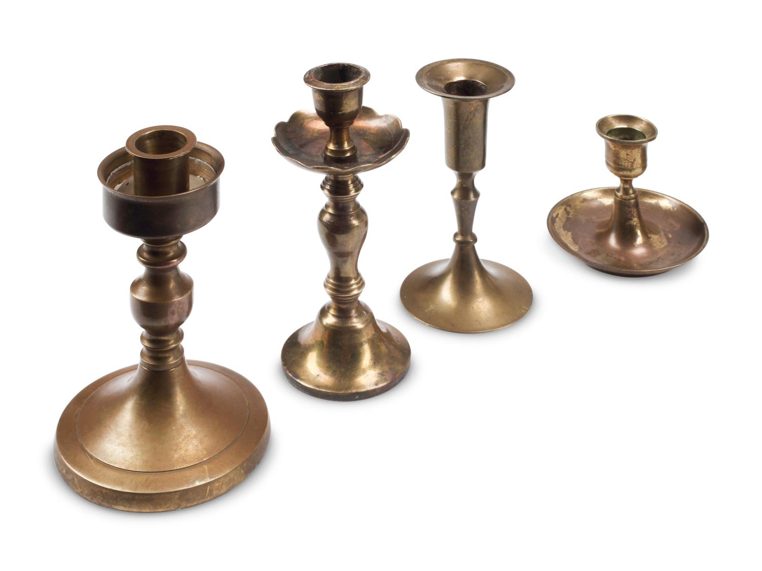 A Collection of Nineteen Brass Candlesticks