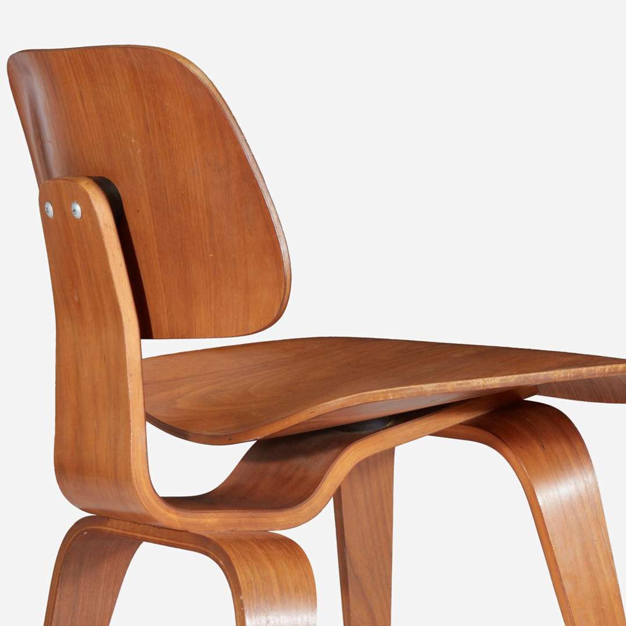 Charles Eames (American, 1907-1978) & Ray Eames (American, 1912-1988) Pair of "DCW" Lounge Chairs, USA, Designed 1946, the Present Lot circa 1950s
