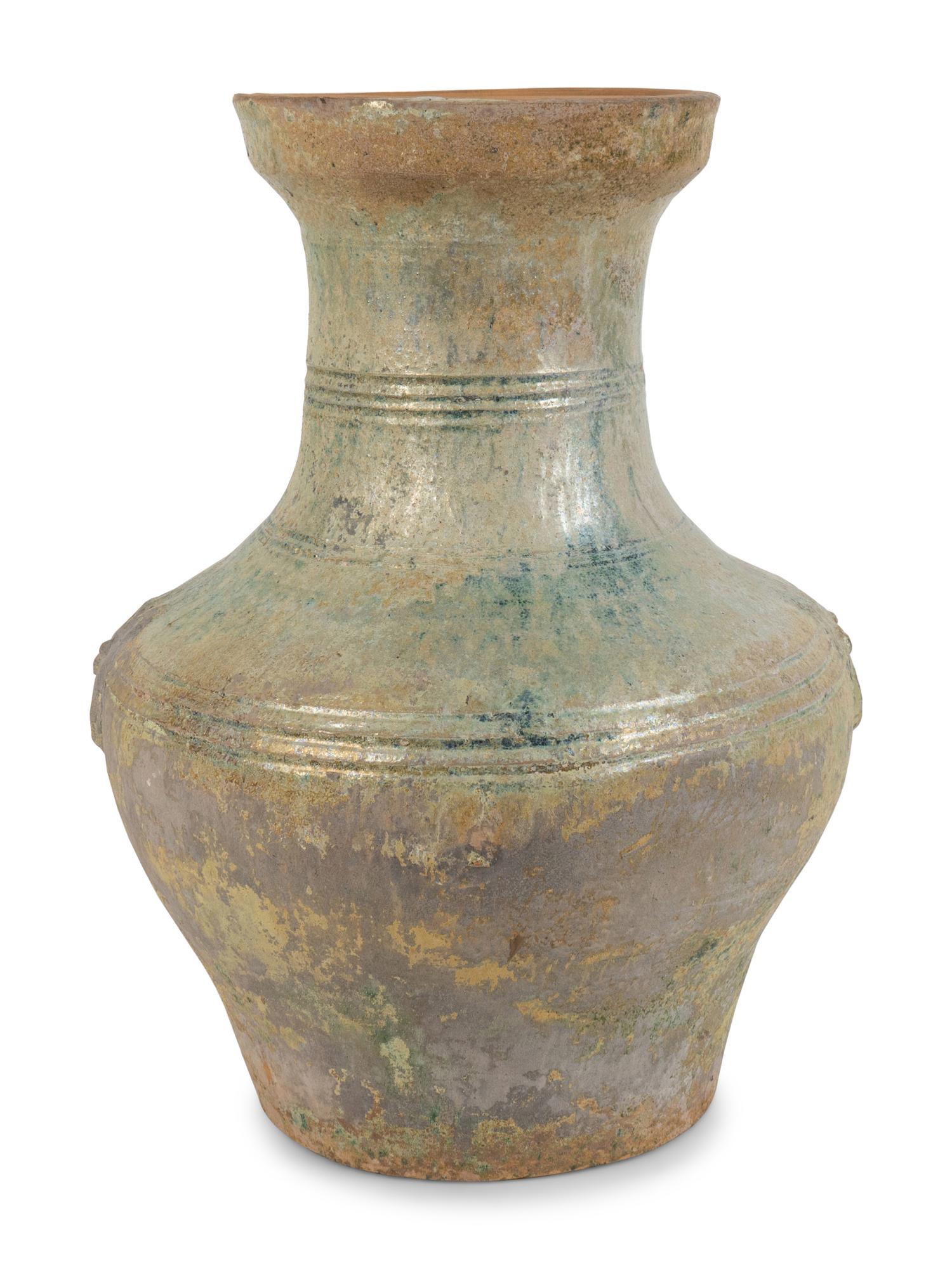 A Chinese Light Green-Glazed Terracotta Hu-Form Vase — HAN DYNASTY