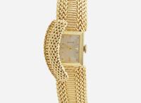 A Ladies 14K Yellow Gold Hidden Dial Watch