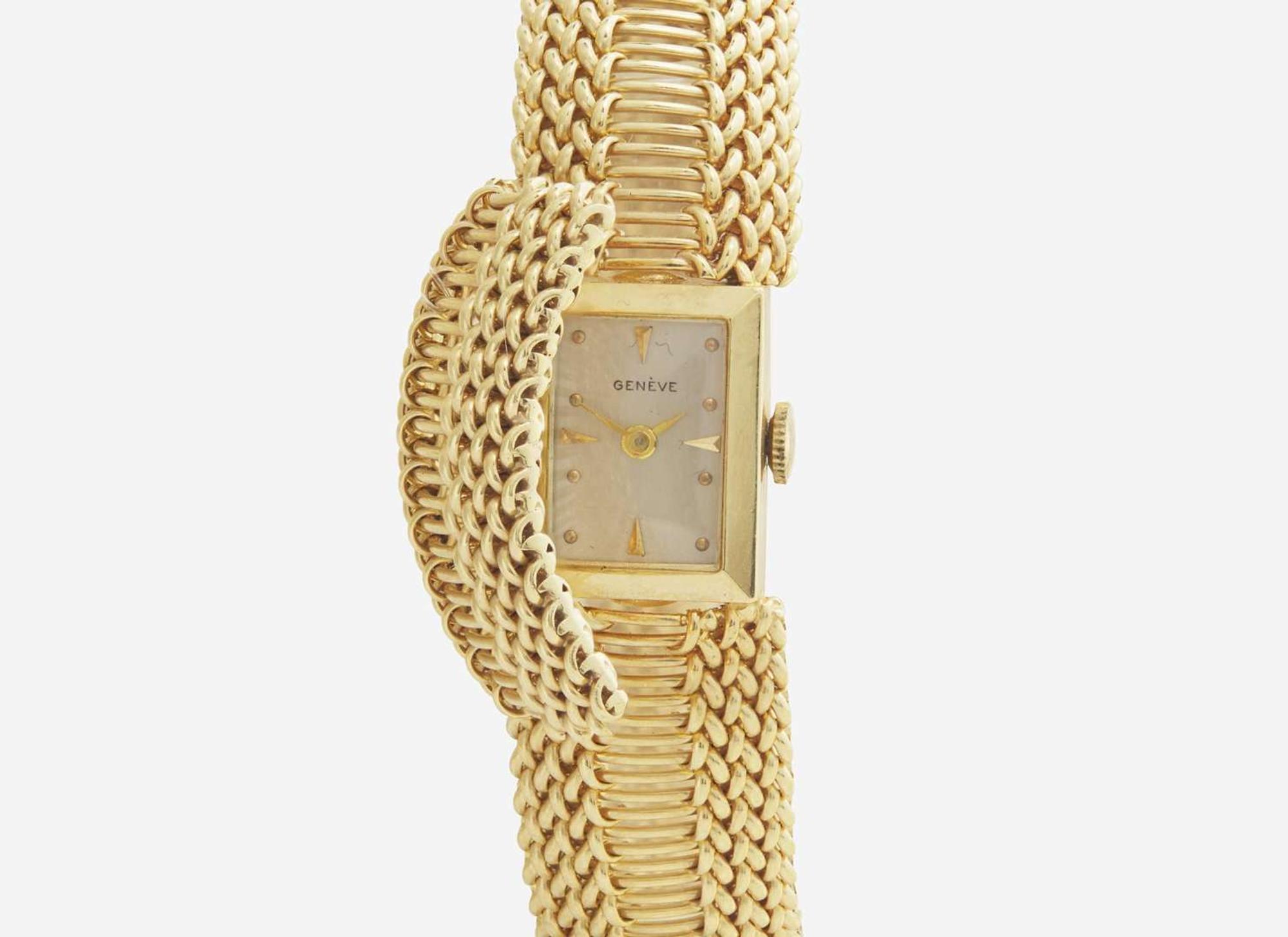 A Ladies 14K Yellow Gold Hidden Dial Watch