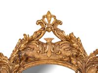 A Baroque Style Giltwood Mirror