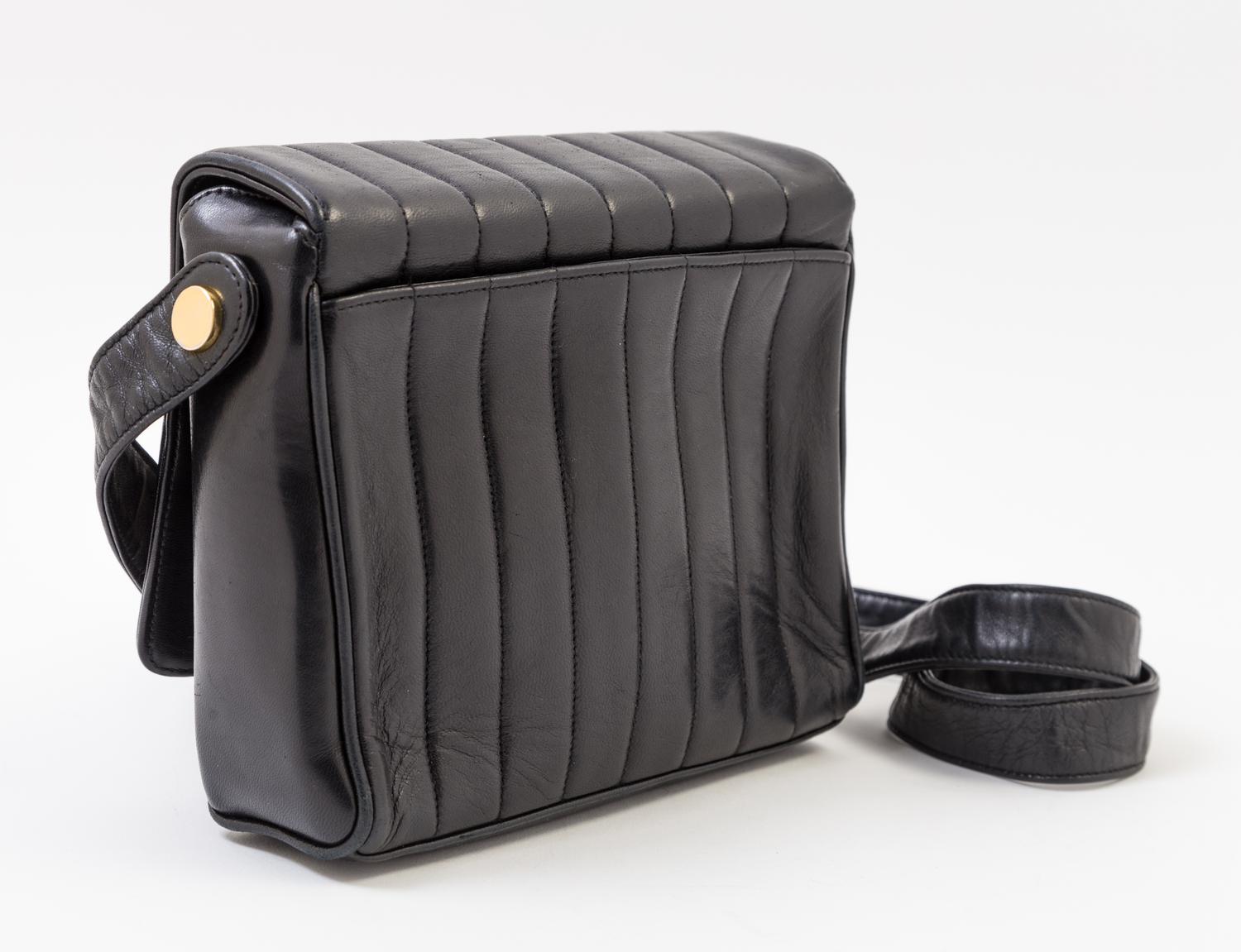 A Chanel Black Lambskin Vertical Quilt Flap Shoulder Bag, 7.5" x 7" x 2". Strap drop: 19".