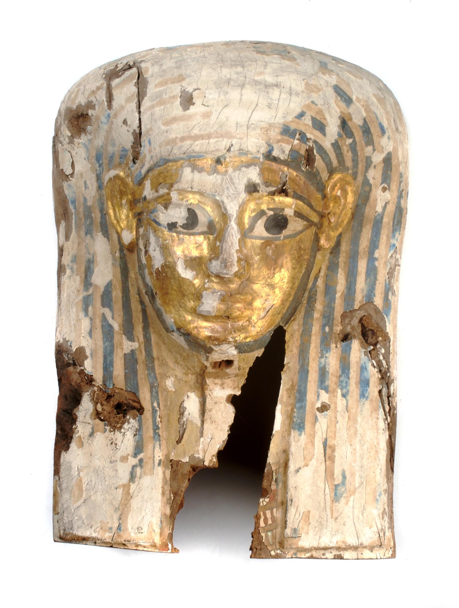 An Egyptian Painted Wood Sarcophagus Mask, Height 22 inches.