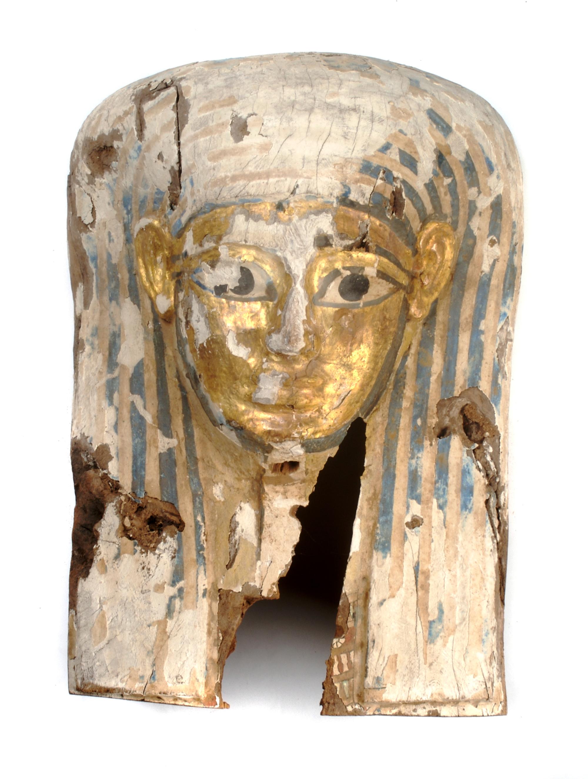 An Egyptian Painted Wood Sarcophagus Mask, Height 22 inches.