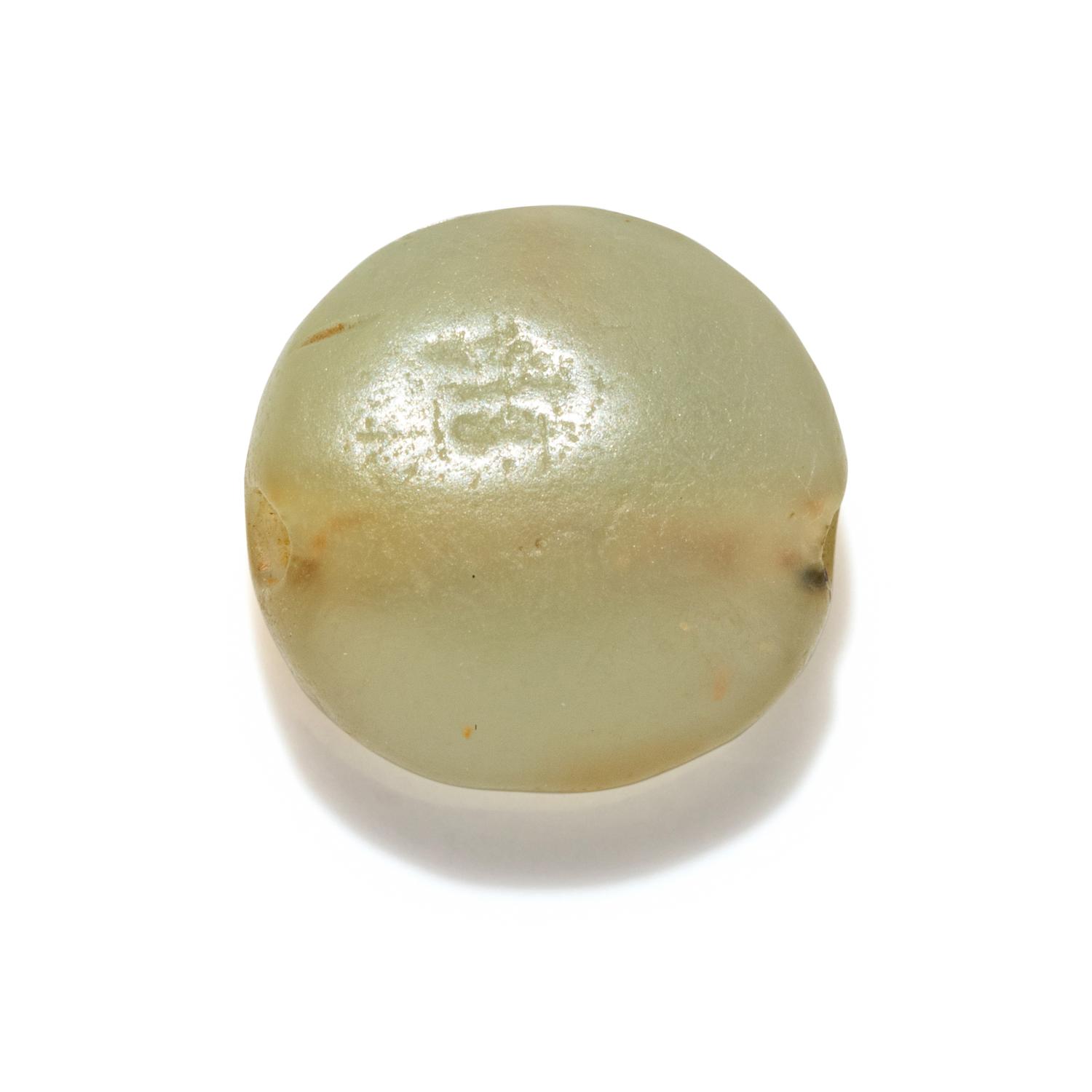 A Minoan Pale Green Steatite Lentoid with a Figure on Horseback