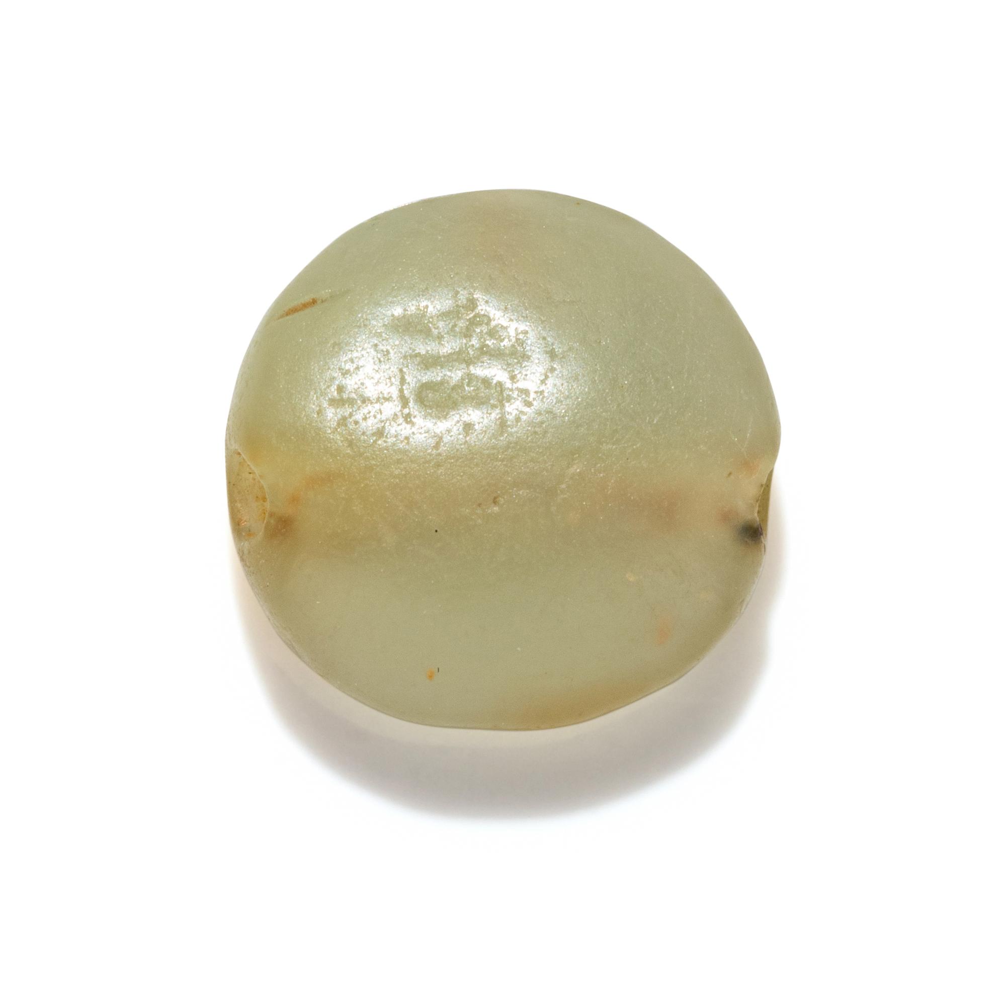 A Minoan Pale Green Steatite Lentoid with a Figure on Horseback