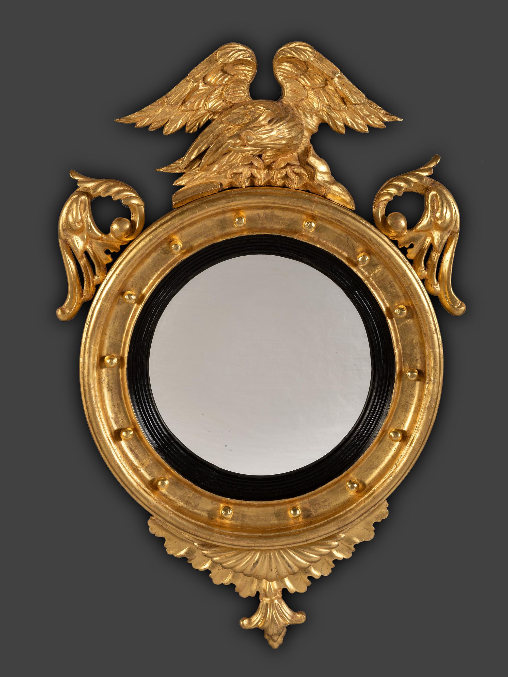 A Pair of Federal Giltwood Bull's Eye Looking Glasses