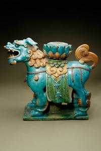 A Turquoise, Ochre and Green Glazed Tileworks 'Fu Lion' Stand