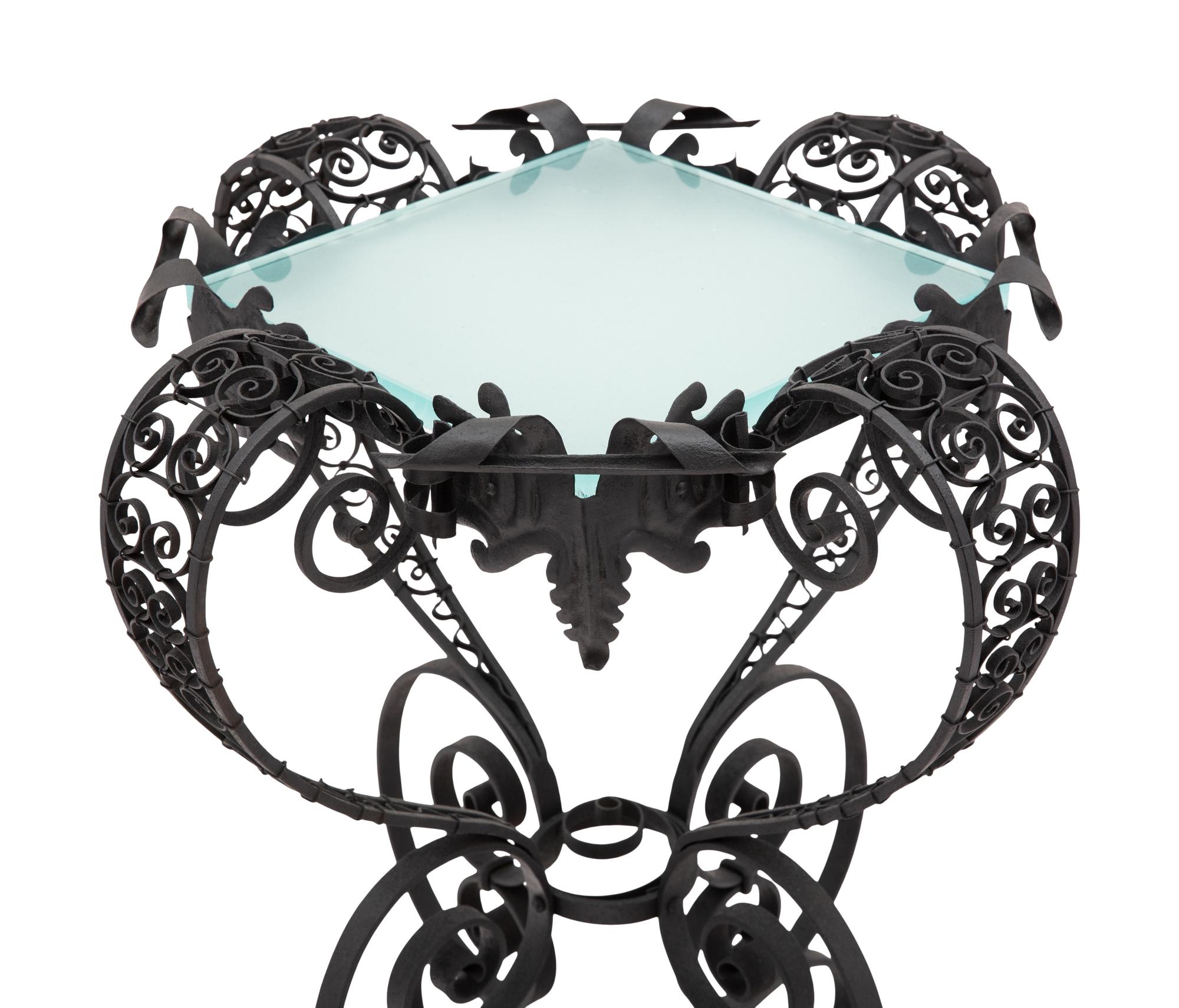 A Spanish Colonial Style Wrought Iron and Glass Stand