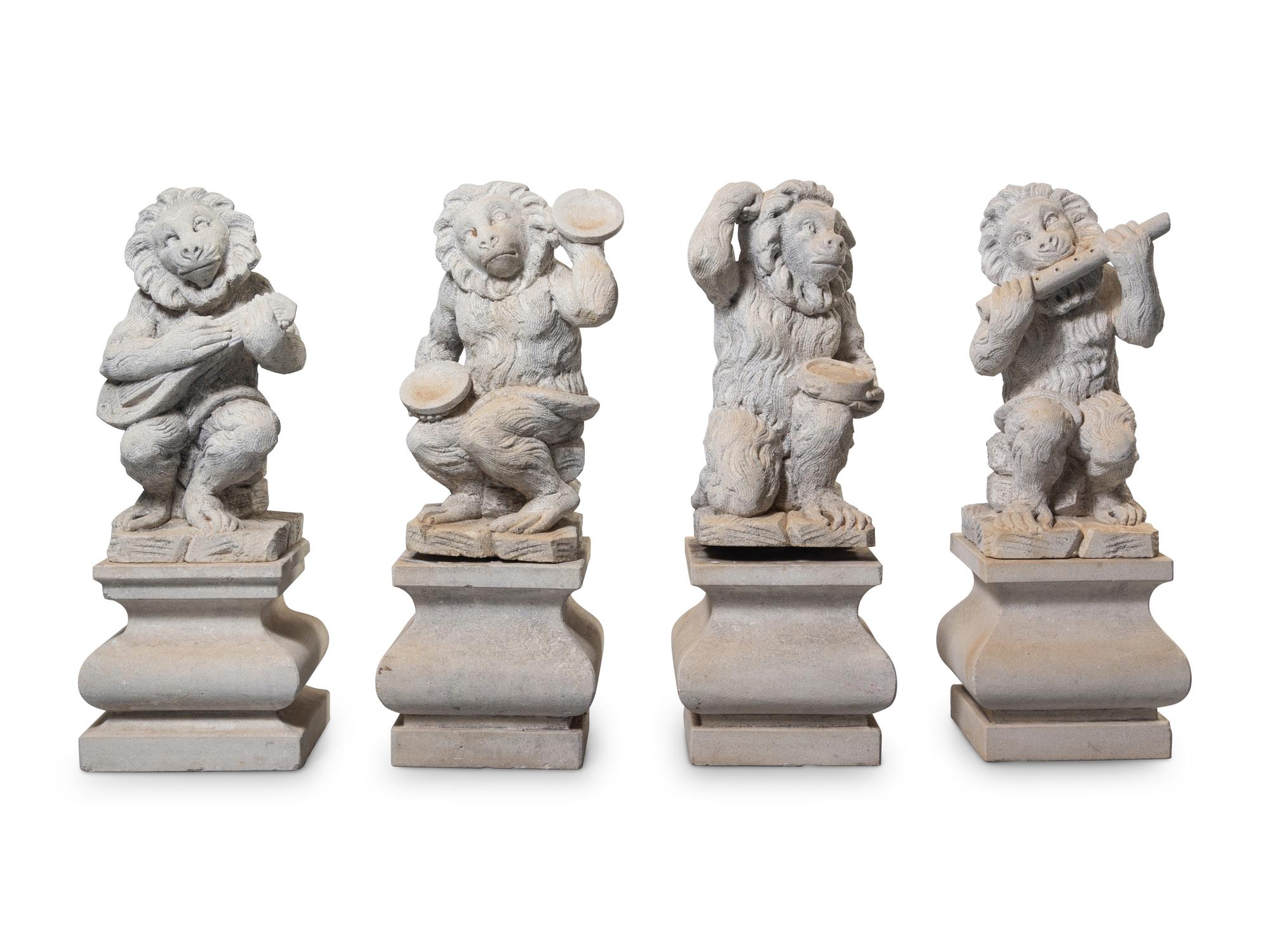 A Set of Four Italian Limestone Figures of Monkey Musicians