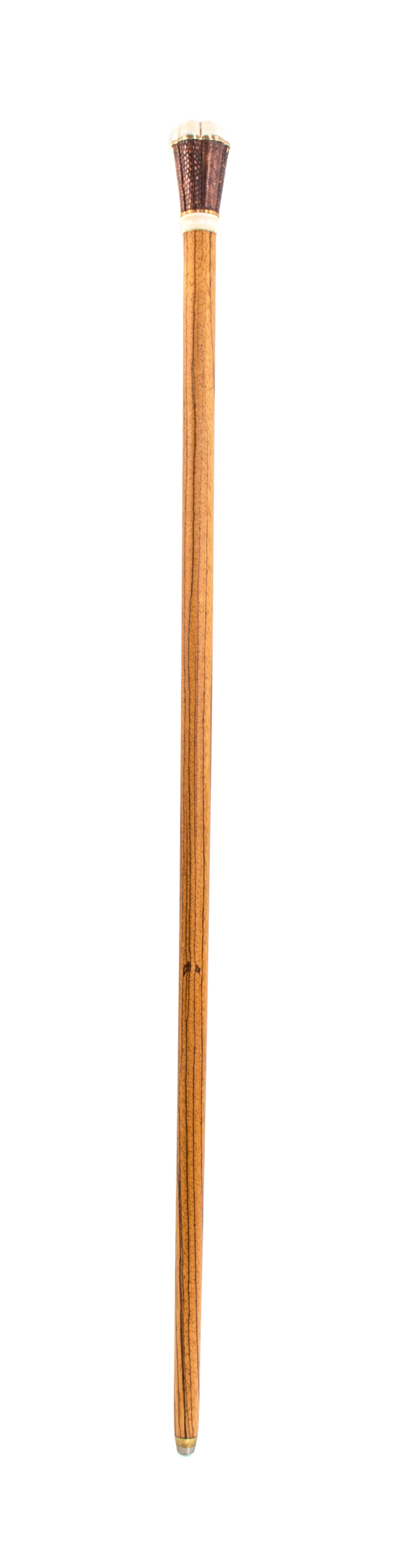 An American Ivory Handled Walking Stick, Length of handle 2 3/4 x length overall 34 7/8 inches.
