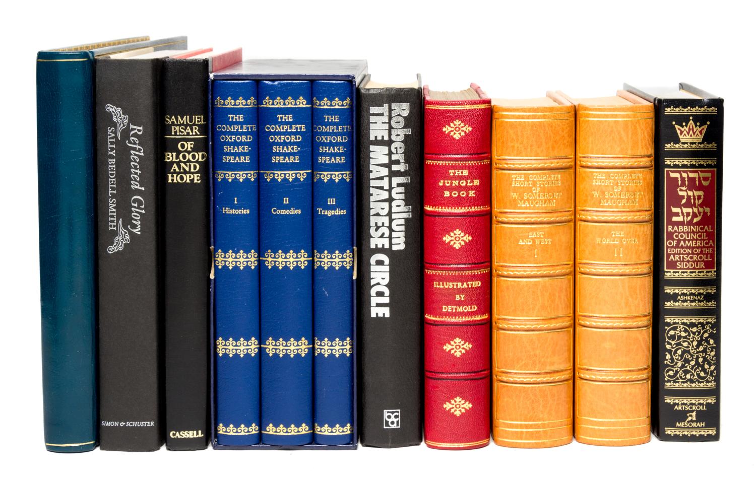 (BINDINGS) A collection of books, largely leather-bound.