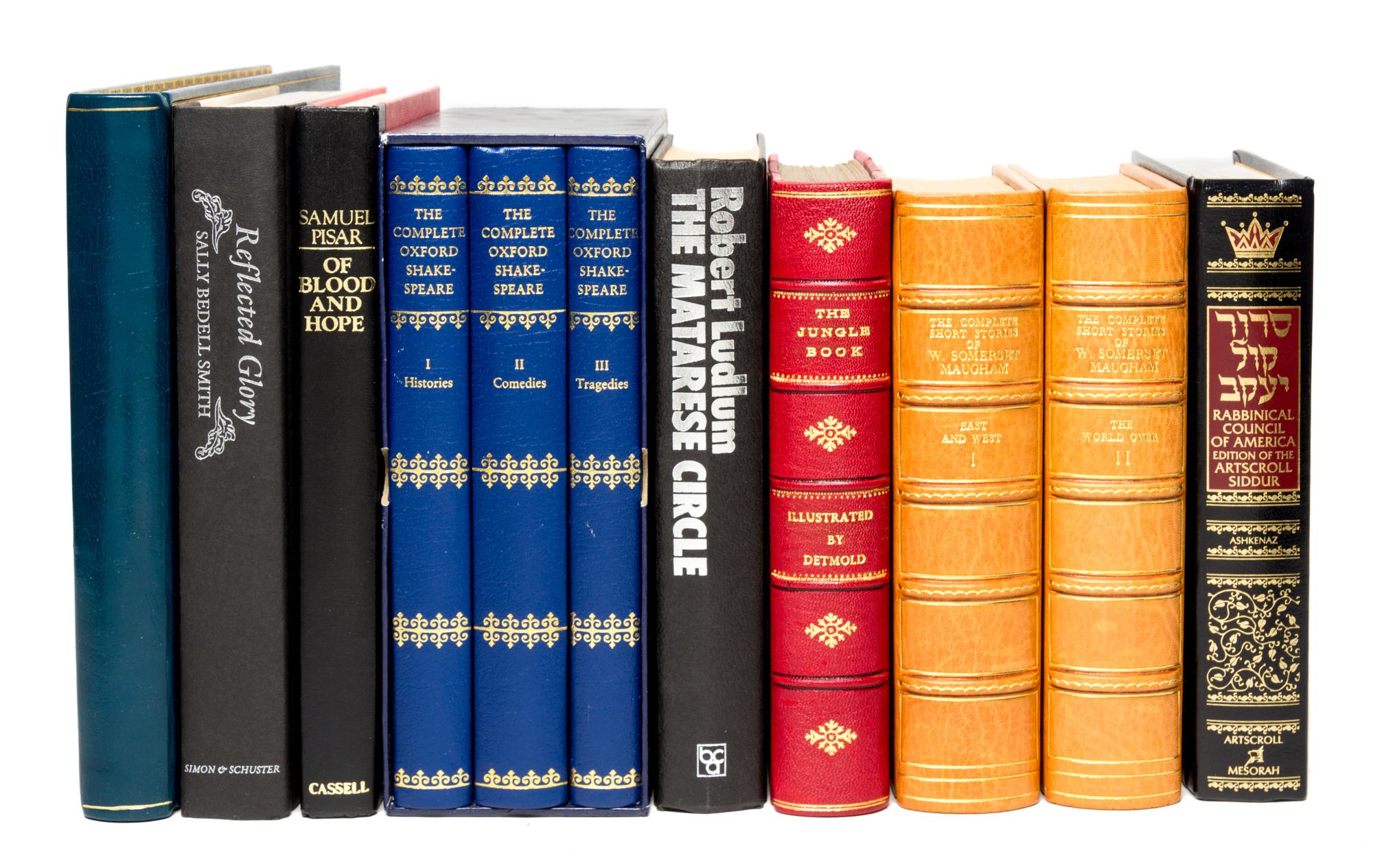 (BINDINGS) A collection of books, largely leather-bound.