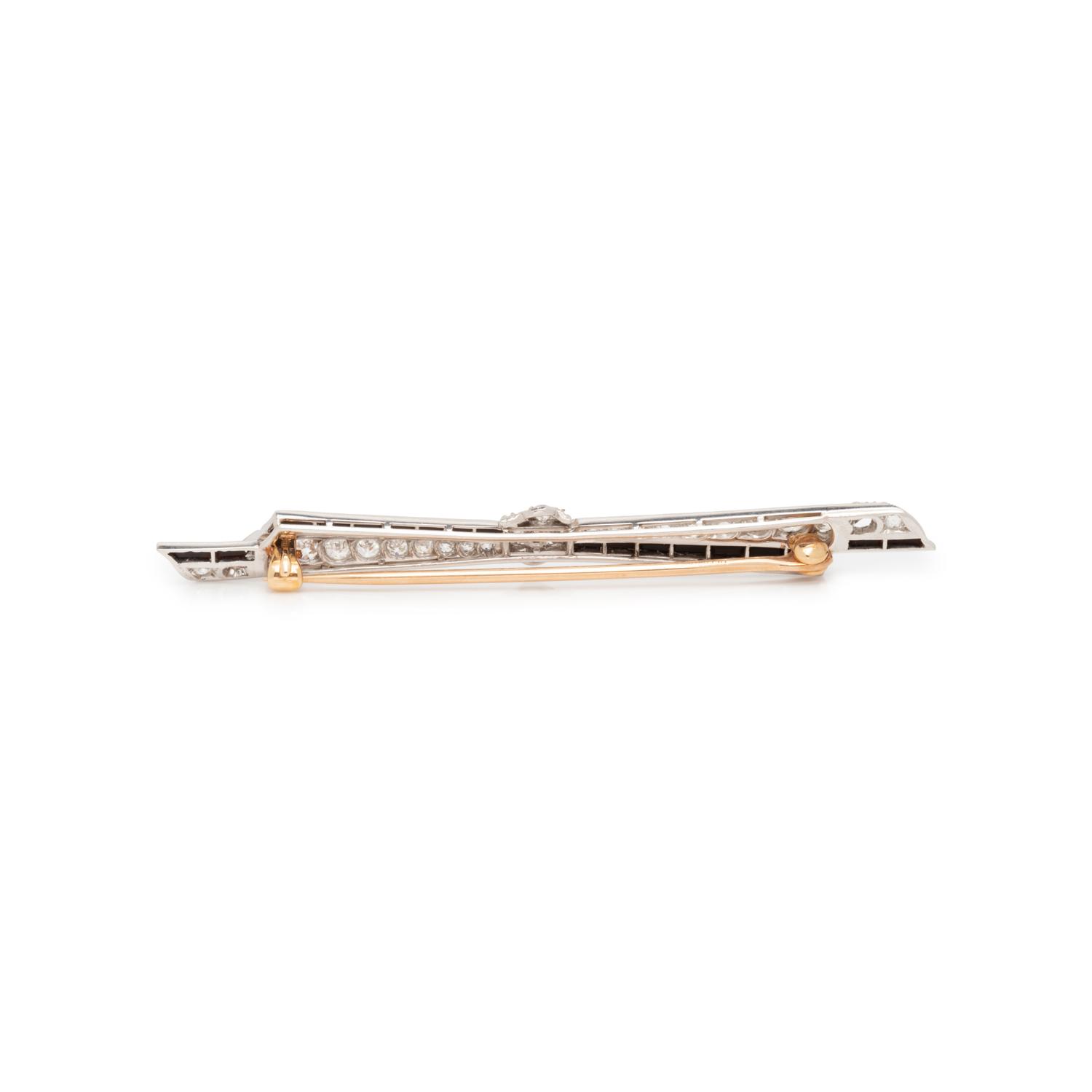 ART DECO, DIAMOND AND ONYX BOW BROOCH