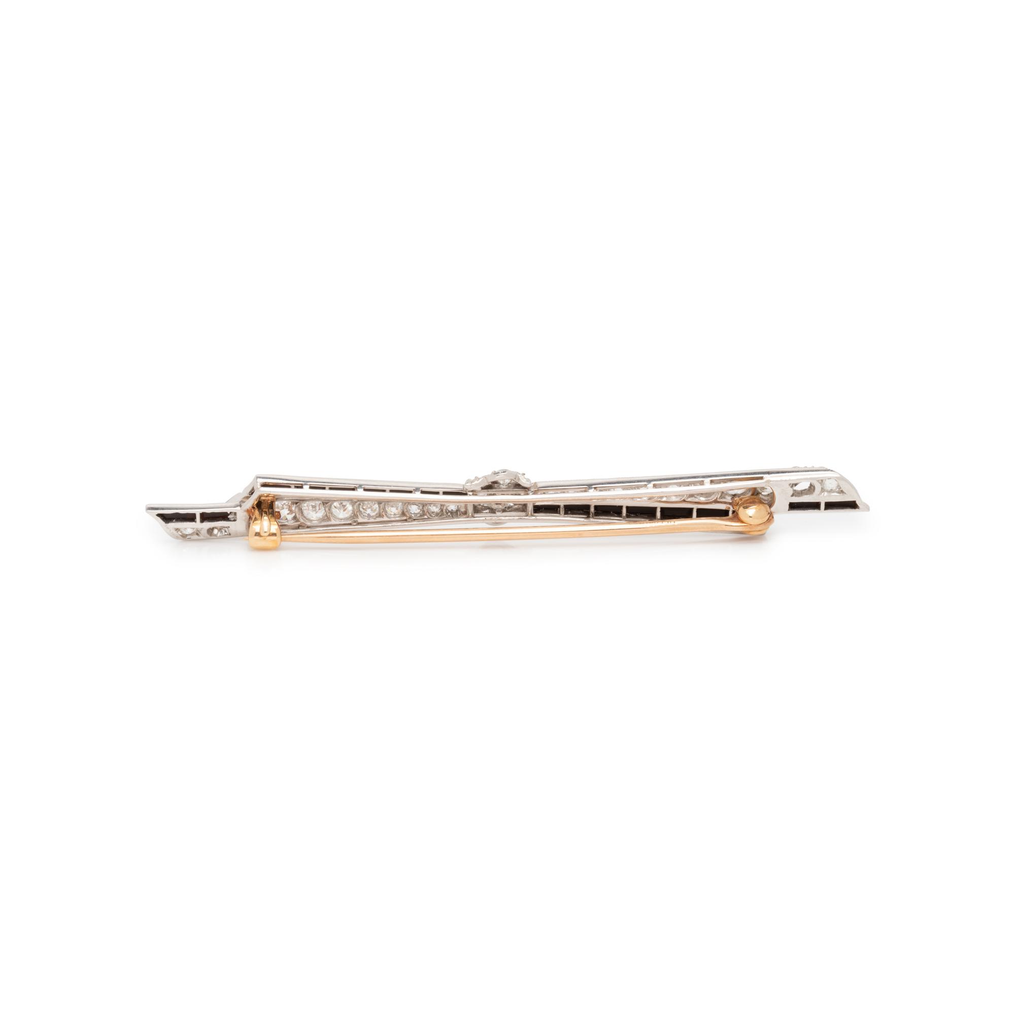 ART DECO, DIAMOND AND ONYX BOW BROOCH