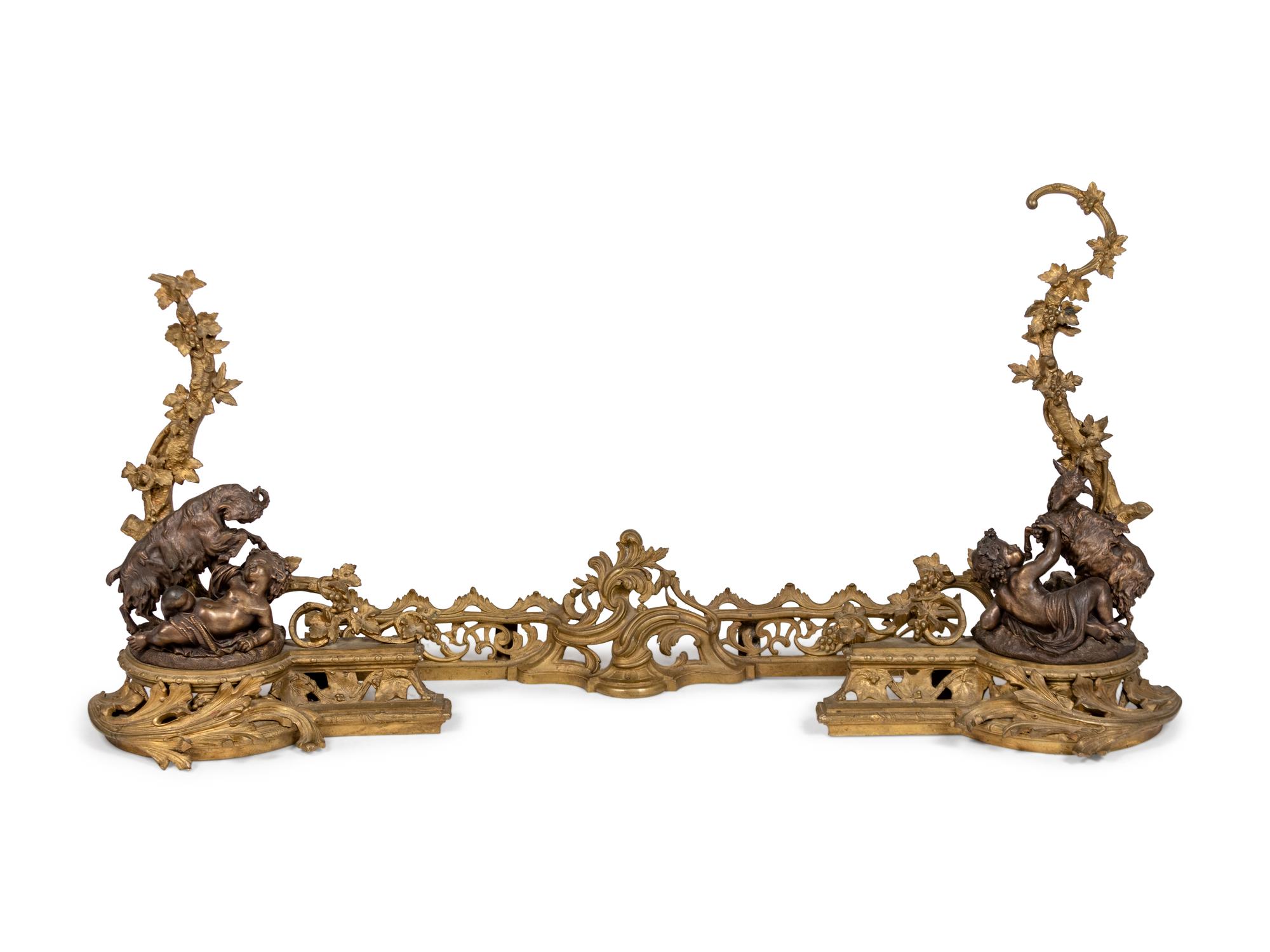 A Pair of Louis XV Style Bronze Andirons with a Fireguard