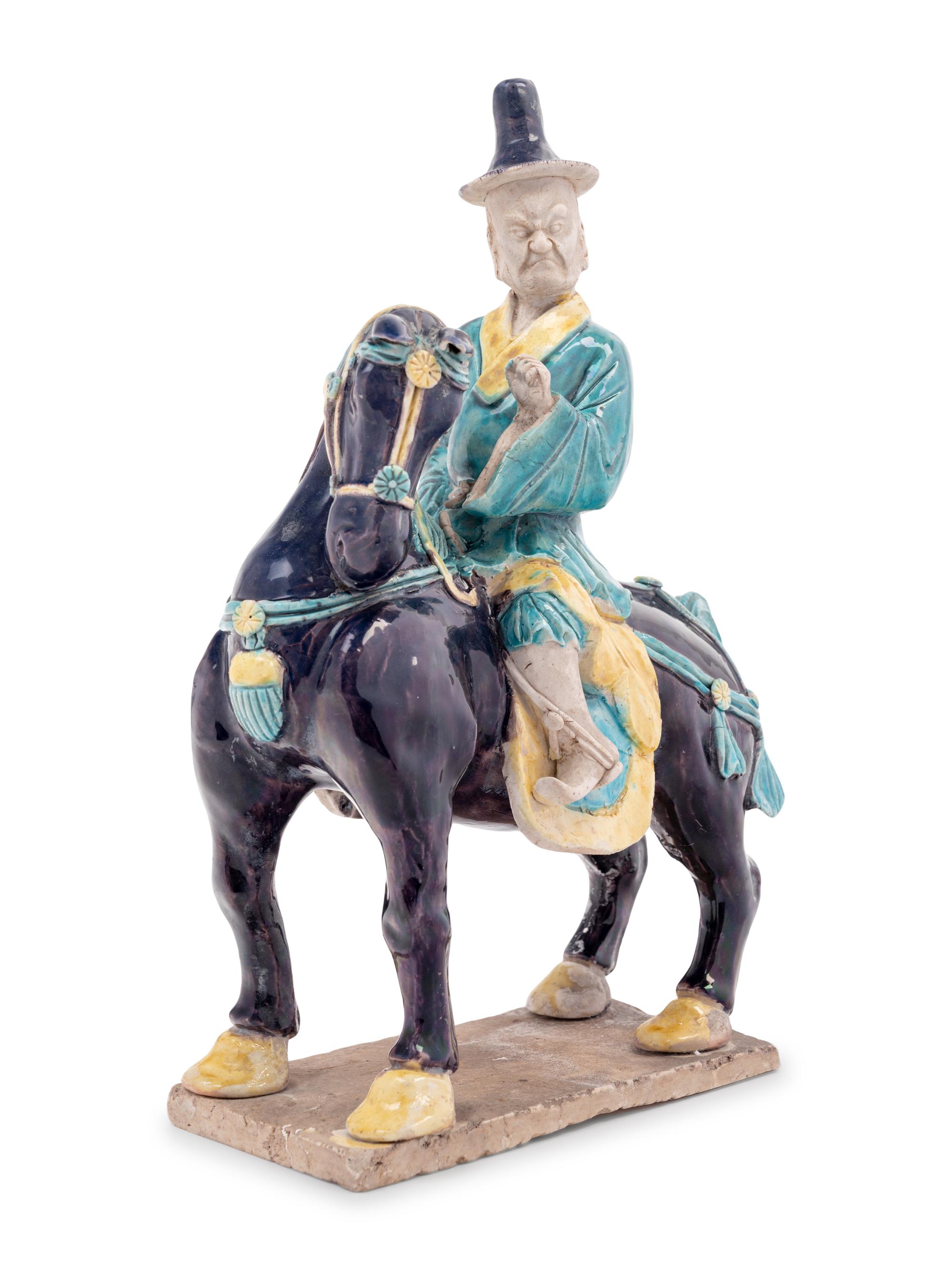 A Chinese Purple, Yellow and Blue Glazed Porcelain Equestrian Figure