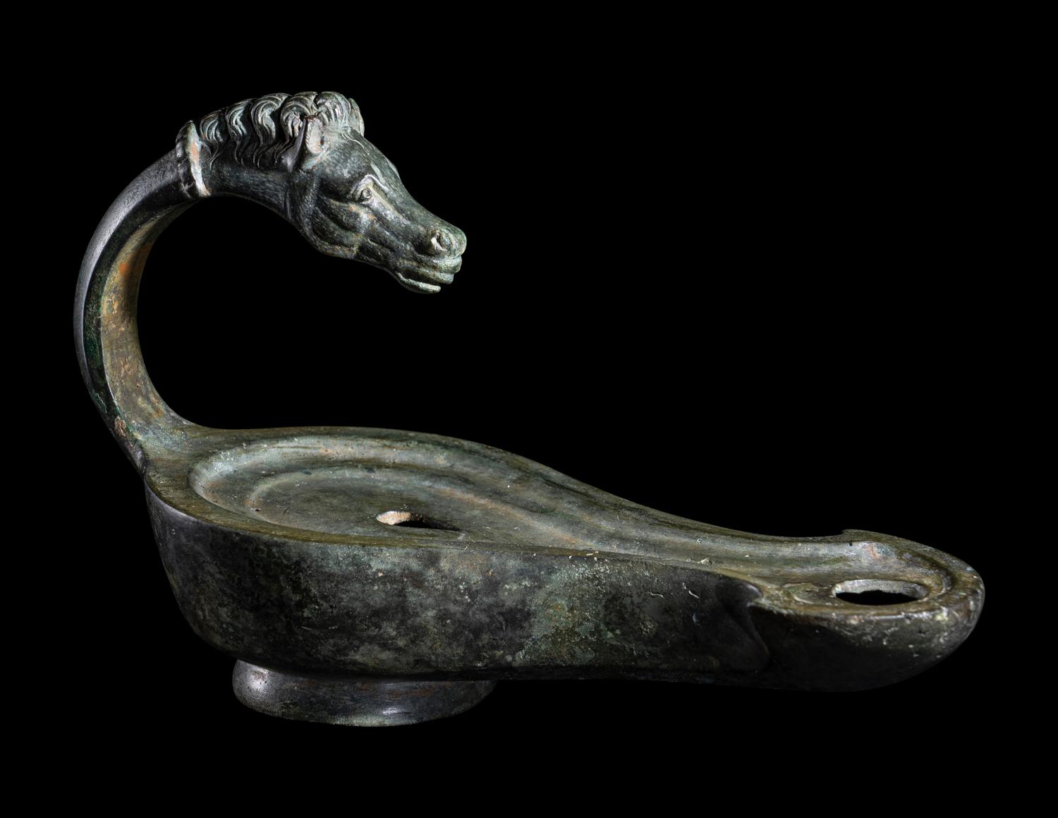 A Roman Bronze Horse Head Oil Lamp