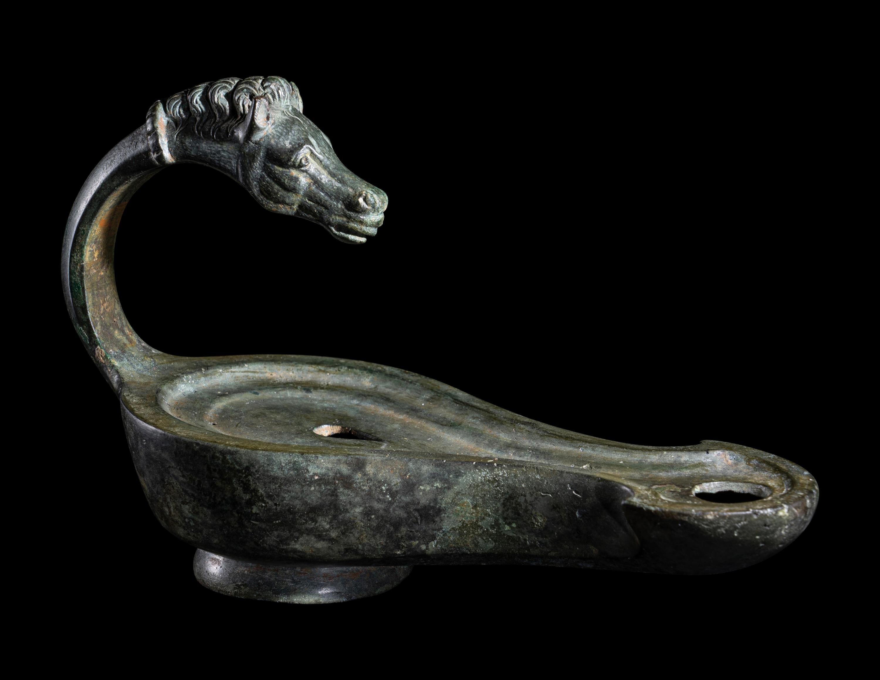 A Roman Bronze Horse Head Oil Lamp