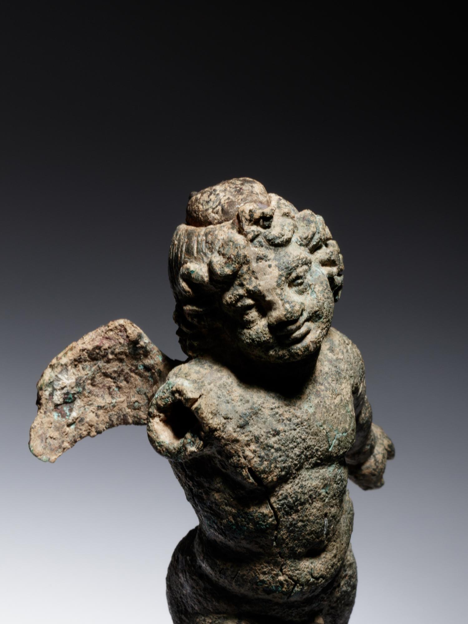 A Roman Bronze Figure of Eros