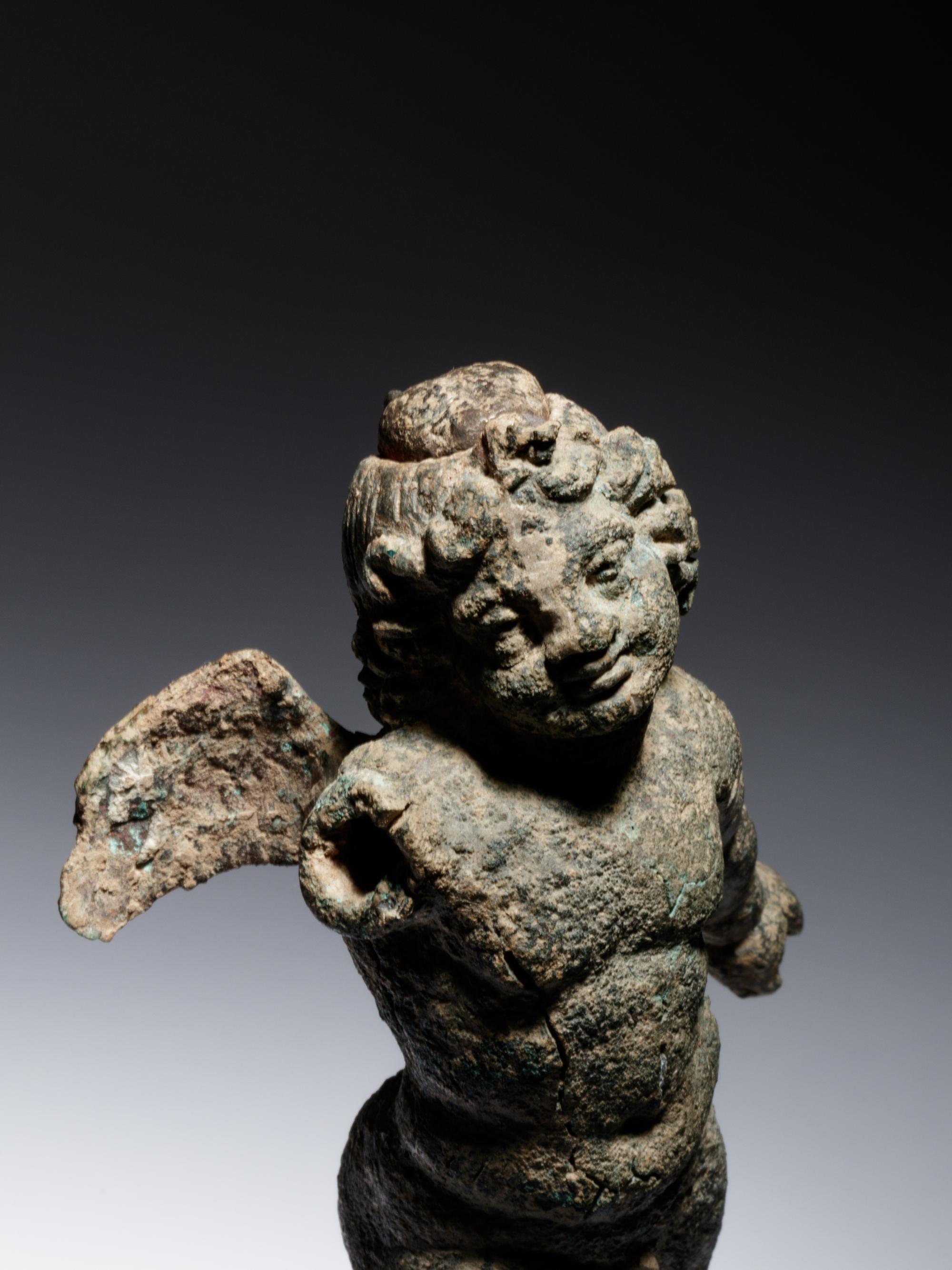 A Roman Bronze Figure of Eros