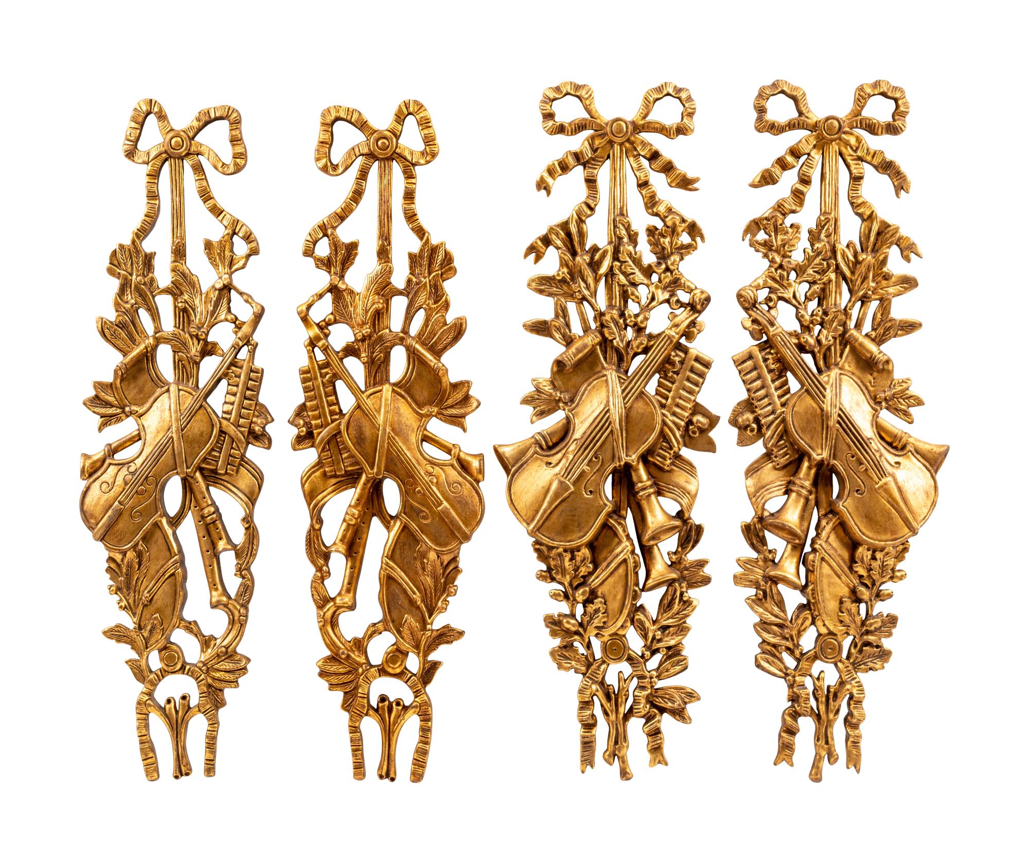 A Set of Four French Giltwood Trophy Appliqués