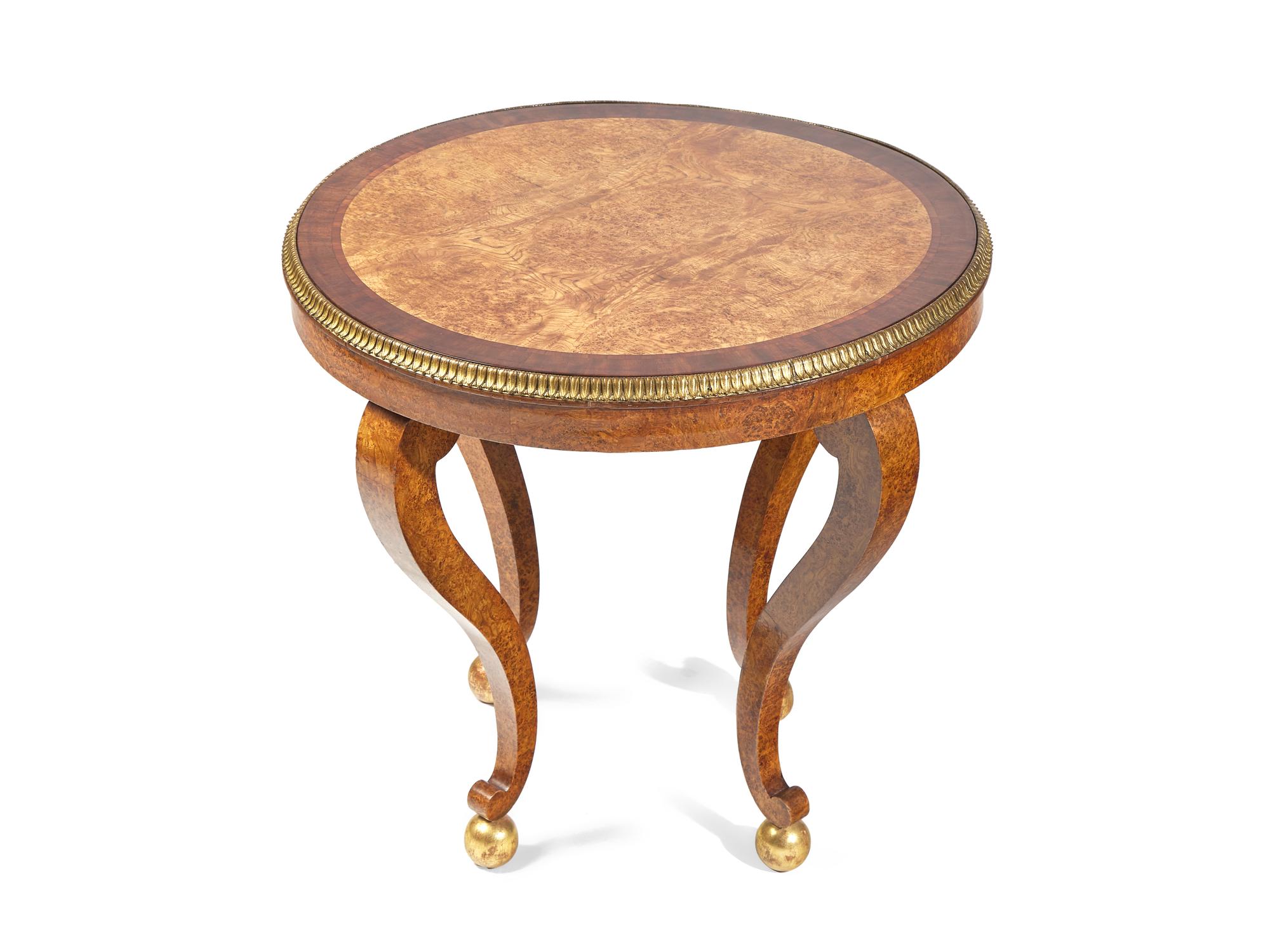 A Charles X Amboyna, Rosewood and Gilt-Bronze Mounted Occasional Table