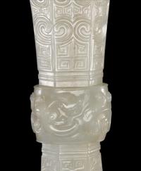 A Carved White Jade Gu Vase