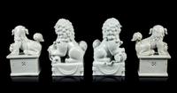 Two Pairs of Chinese Blanc-de-Chine Porcelain Figures of Fu Lions