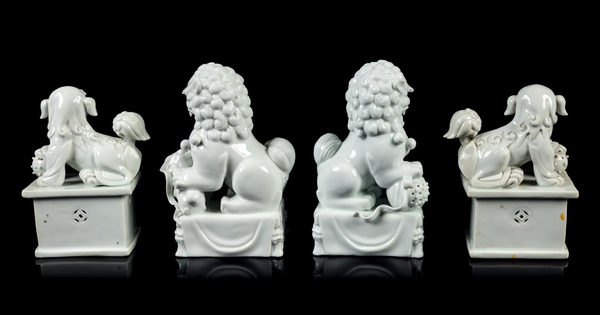 Two Pairs of Chinese Blanc-de-Chine Porcelain Figures of Fu Lions