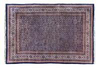 An Indo-Persian Wool Rug 8 feet 7 inches x 11 feet 4 inches.